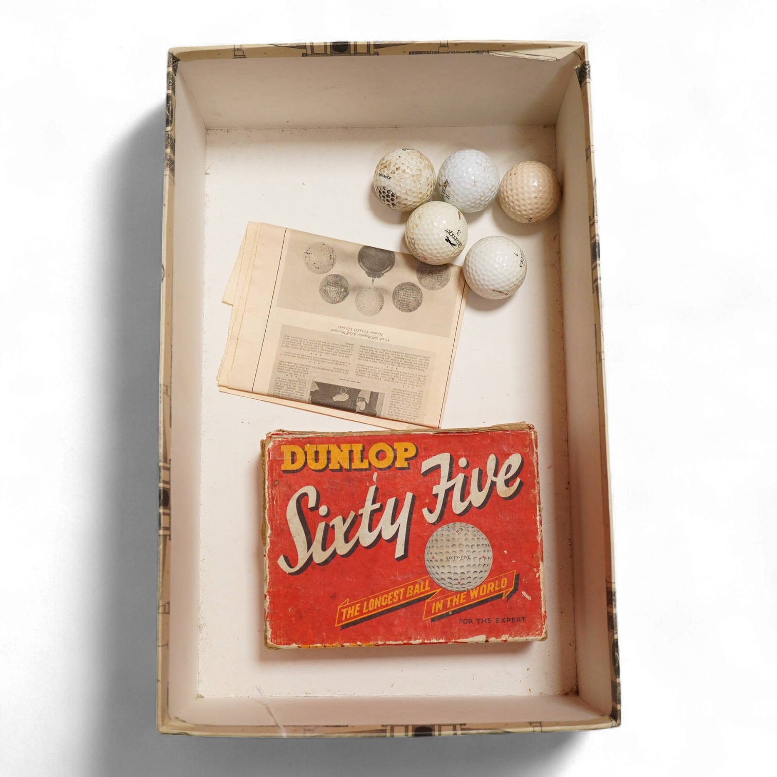 A box of vintage golf balls to include Dunlop